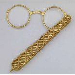 French 750 gold lorgnette bearing the mark "Cartier Paris N5169" on the bridge, gross weight 77.