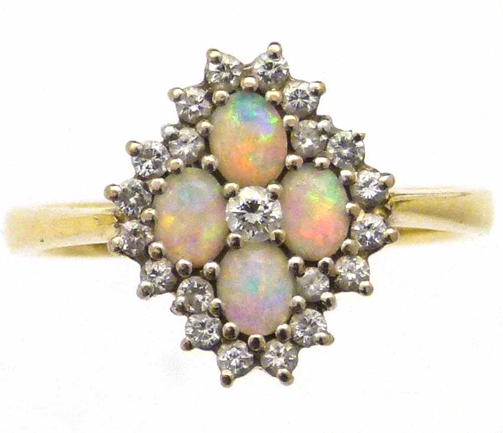Opal and diamond quatrefoil cluster ring, set in 750 yellow gold, ring size O, 3.9g gross.