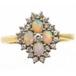 Opal and diamond quatrefoil cluster ring, set in 750 yellow gold, ring size O, 3.9g gross.