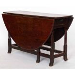 Oak gate-leg table circa 1700, the oval top over a single end drawer on block and turned legs and