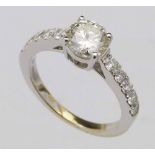 Single stone diamond ring, 1.02ct round brilliant, on diamond set shoulders, indicated 0.53ct, in