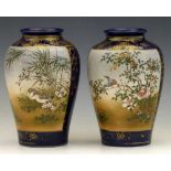 Pair of Japanese Satsuma vases of blue ground painted with panels of birds amongst blossom,