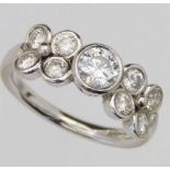 18ct white gold nine stone diamond ring, the central brilliant approximately 0.85ct, flanked by