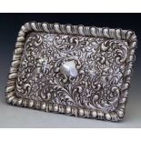 Embossed silver rectangular dressing table tray decorated with leaf scrolls, James Dixon & Sons,