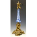 OIl lamp stem of blue and white cased glass and gilt brass mounts of vines, circa 1880, height