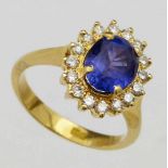 Tanzanite and diamond oval cluster ring in an 18K yellow setting, ring size L+, 5.0g gross