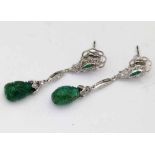 Pair of carved emerald and diamond pendent earrings, length 38mm.