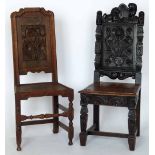 Two 17th century style oak hall chairs with carved panel backs.