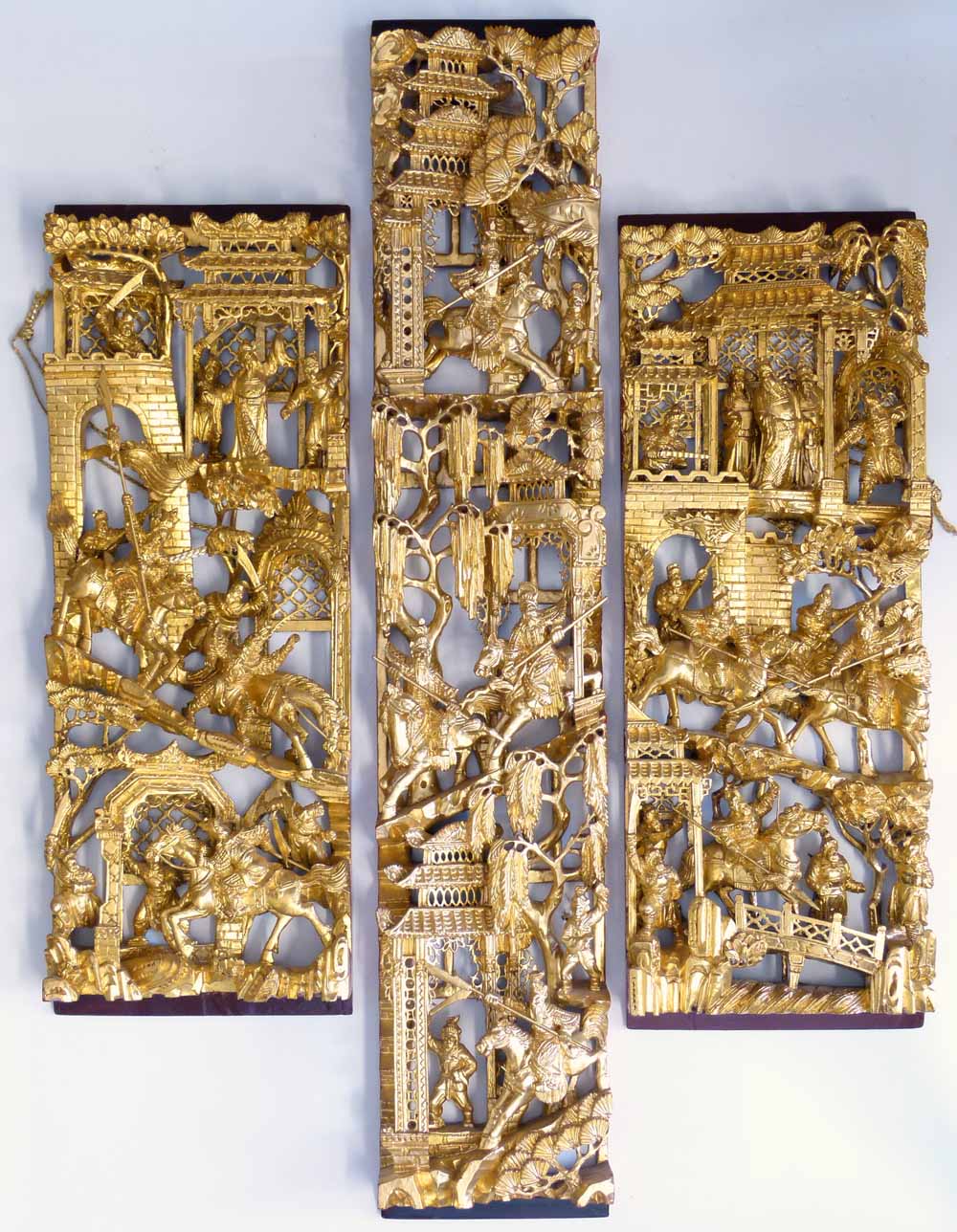 Pair of Cantonese carved gilt wood panels and a larger similar panel each carved with mounted