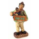 Royal Doulton figure of the Organ Grinder, HN. 2173 21cm high Condition report: Heavy deep crazing