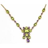 Edwardian style 375 gold peridot and amethyst pendant necklace and chain, length 39cm.
Condition