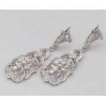 Pair of white gold diamond pendent earrings, approximately 1.2ct in total, length 5cm,