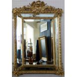 Gilt wood and gesso Georgian style wall mirror, circa 1900, the raised rectangular plate within