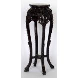 Chinese rosewood jardiniere stand, the inset marble top in a frame carved with blossom, height