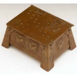 Copper Arts & Crafts trinket box embossed with stylised florets, nail heads and cutwork hinges,