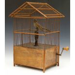 Singing bird in a cage automaton, rectangular with wood and wire sides, winding by a cranked handle,