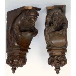 Two carved oak neo gothic wall brackets of renaissance figures holding shields, height 73cm.