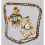 9ct gold and blue stone pendant shaped with four petal shaped lobes, width 31mm; a somewhat