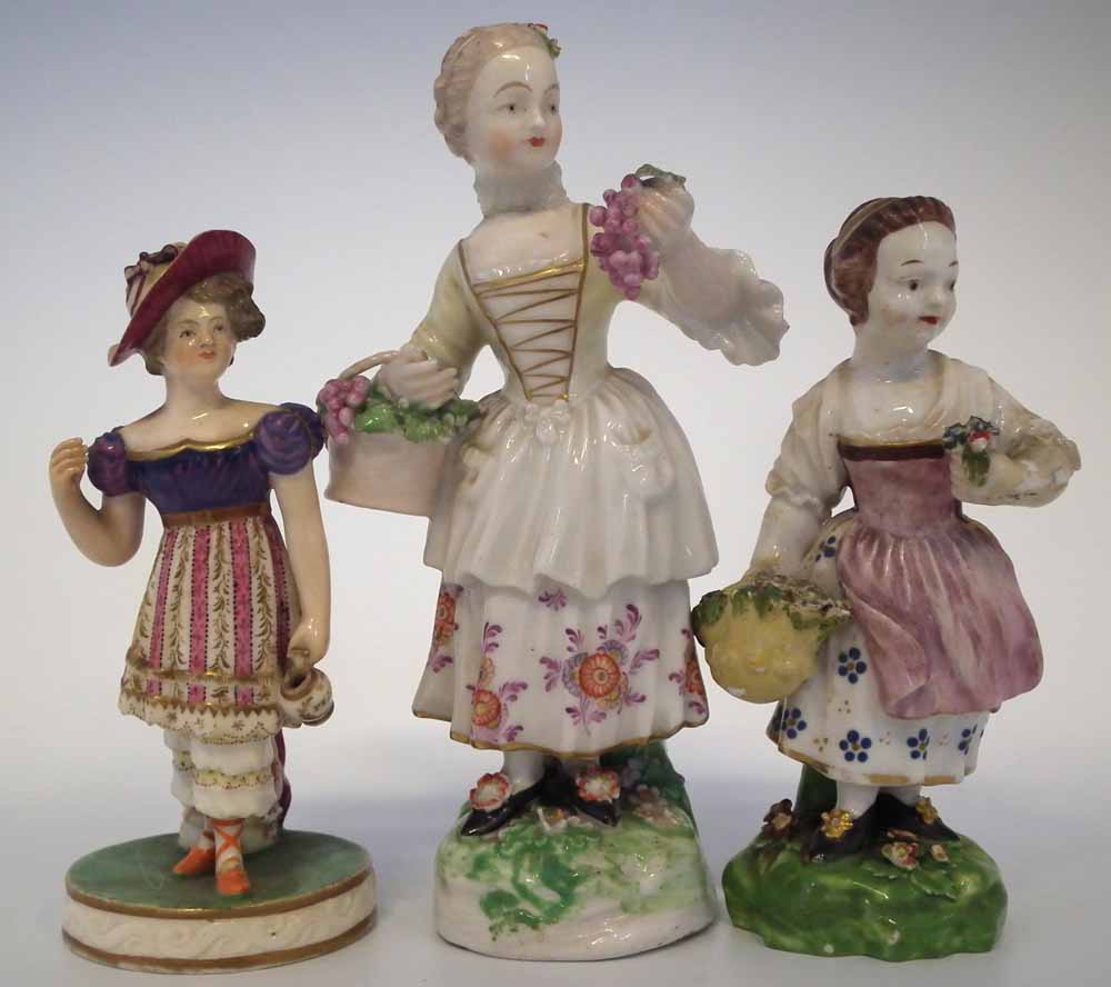 Three Derby figures of girls circa 1800 two modelled with baskets of fruit and flora, one modelled