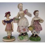 Three Derby figures of girls circa 1800 two modelled with baskets of fruit and flora, one modelled