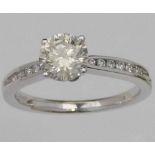 Single stone diamond ring, 1.09ct, on diamond set shoulders in 750 white gold, ring size M