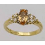 Oval citrine and diamond ring in 750 yellow gold, ring size O, 4.4g gross.