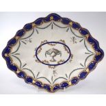 Chelsea Derby lozenge shape dish circa 1780 painted with an urn and classical swags within blue