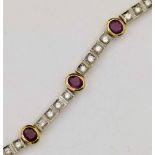 Italian 750 ruby and diamond line bracelet of seven oval rubies interspersed by blocks of four