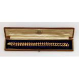 15ct gold flat curb bracelet 24.9g, cased.