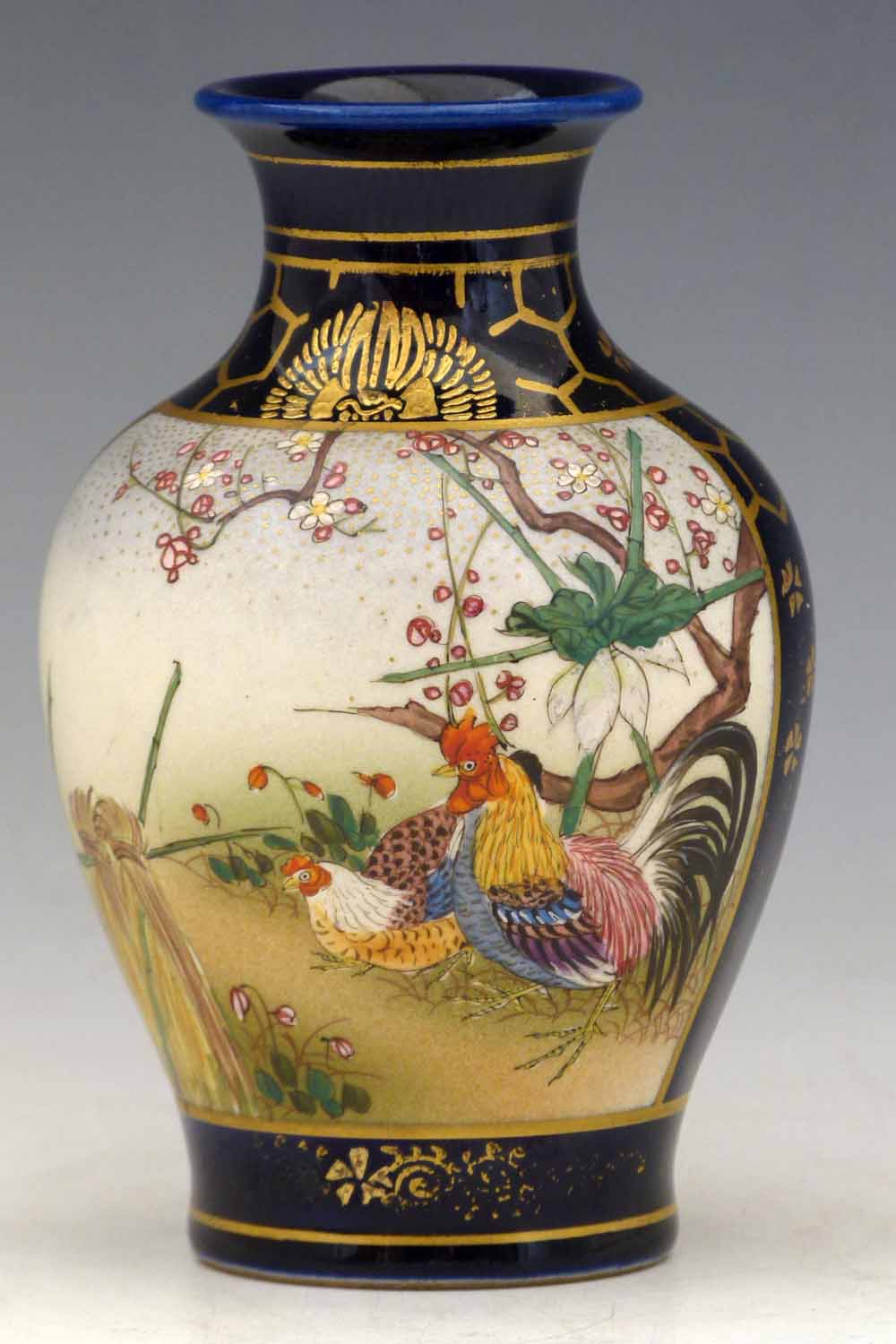 Small Japanese Satsuma vase painted with panels of a cockerel and other birds, remains of seal mark,