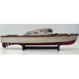 1950's model boat (lacking motor). Condition report: see terms and conditions