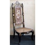 Victorian papier mache and wood hall chair with a cane seat, the high back inlaid and painted with a