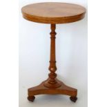 Victorian elm wine table on a turned column and tri-point base, diameter 49cm.