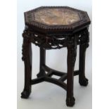 Chinese carved hardwood octagonal low stand with an inset marble top , width 36cm.
 
Condition