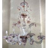 Large glass chandelier with eight branches separated by leaves and floral stems, 105cm high