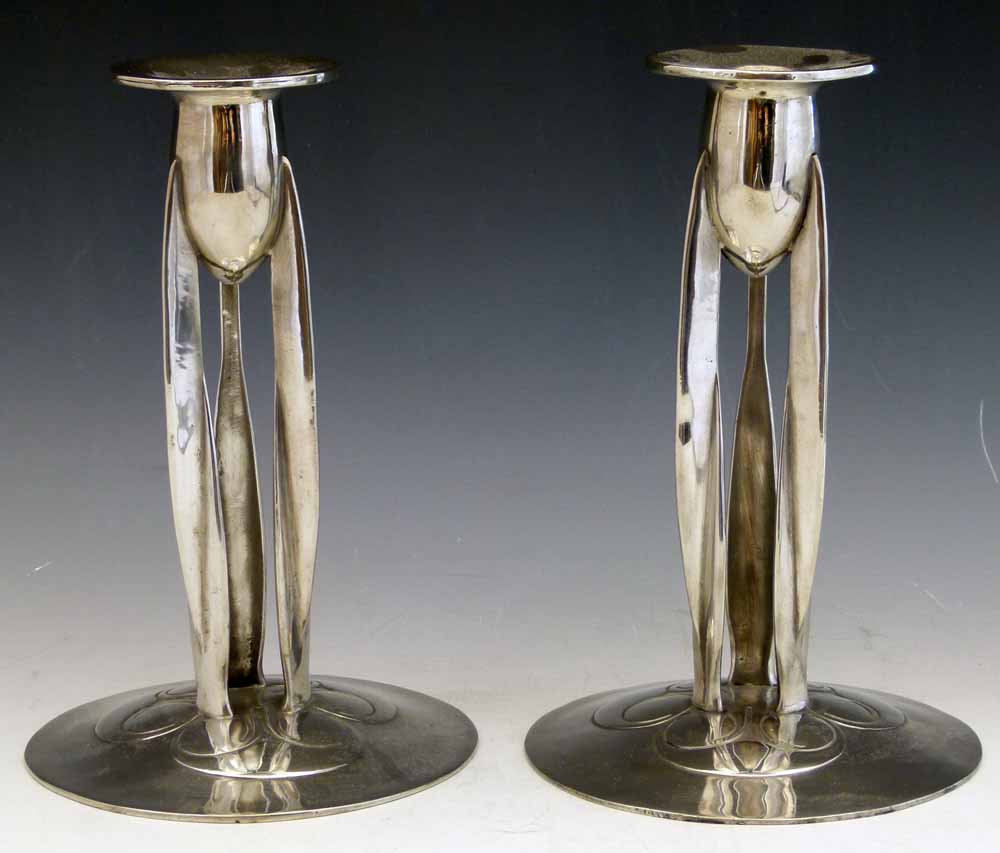 English Pewter pair of Tudric candlesticks, 0223, after the design of Archibald Knox, height 23cm.