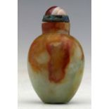 Green jade snuff bottle suffused with a cloud of red, of flattened ovoid form, agate cap and metal