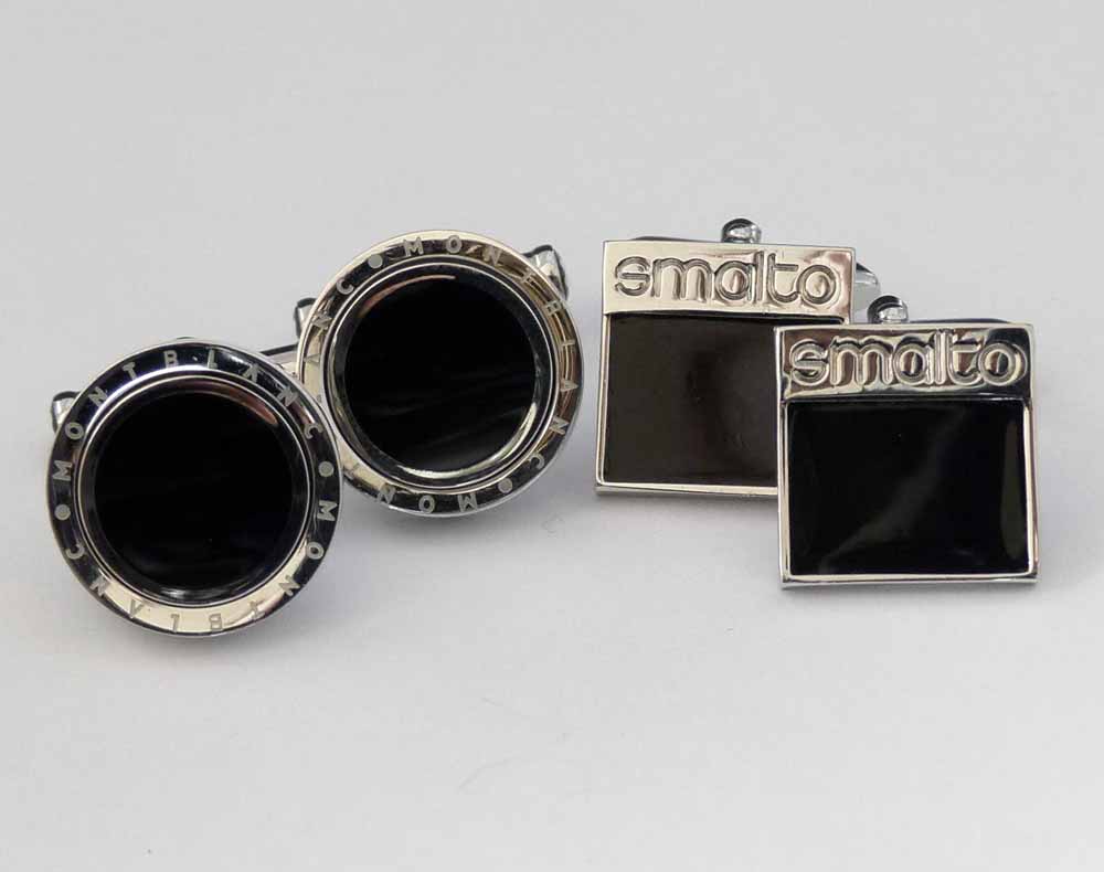 Montblanc chrome steel and black circular cufflinks and a similar pair of Smalto square cufflinks (2