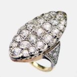 18ct gold and platinum marquise shaped pave diamond ring, the table set with 21 old mine cut stones,