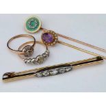 Unmarked gold antique bar brooch set with five rose cut diamonds; an antique gold rose-cut diamond