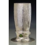 Liberty & Co English Pewter vase, 01145, the hammered body set with three green cabochons, height