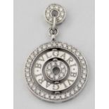 Target pendant set with concentric bands of diamonds and a central rotating ring engraved "