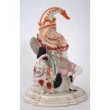 Staffordshire Punch doorstop flat back figure, modelled with dog at his side, mid 19th century, 28cm