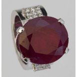 Ruby ring, 25.04ct, oval brilliant cut, set on diamond shoulders in 750 white gold, signed Chaumet