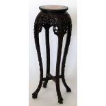 Chinese carved hardwood jardiniere stand with an inset marble top, height 92cm.