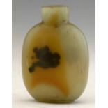 Chalcedony snuff bottle the mutton fat ground suffused with clouds of russet and black, height 7cm.