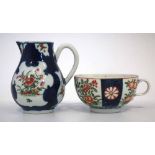 Worcester cream jug and a teacup circa 1770   painted with flora within blue scale grounds, (