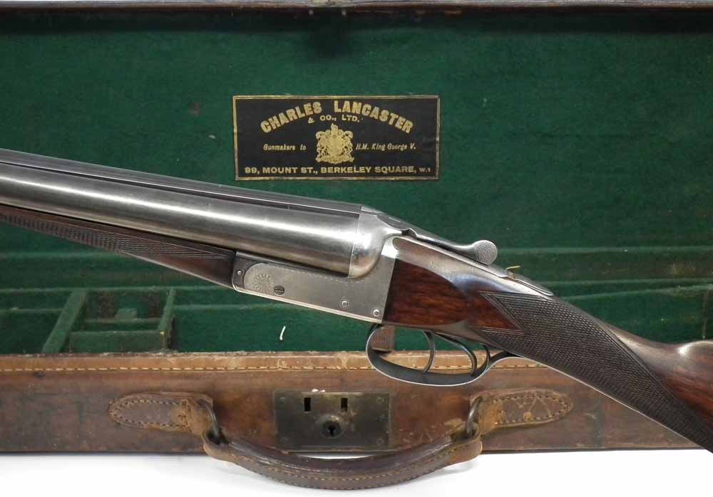 12 bore box lock ejector side by side shotgun, serial number 14181, with sleeved 28 inch barrels, - Image 7 of 12