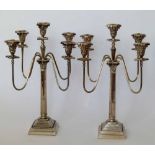 Pair of silver plated neo-classical candelabra both with four reeded branches, height 70cm.