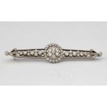 18ct white gold and platinum diamond bar brooch, circa 1920, the central millegrain floret flanked